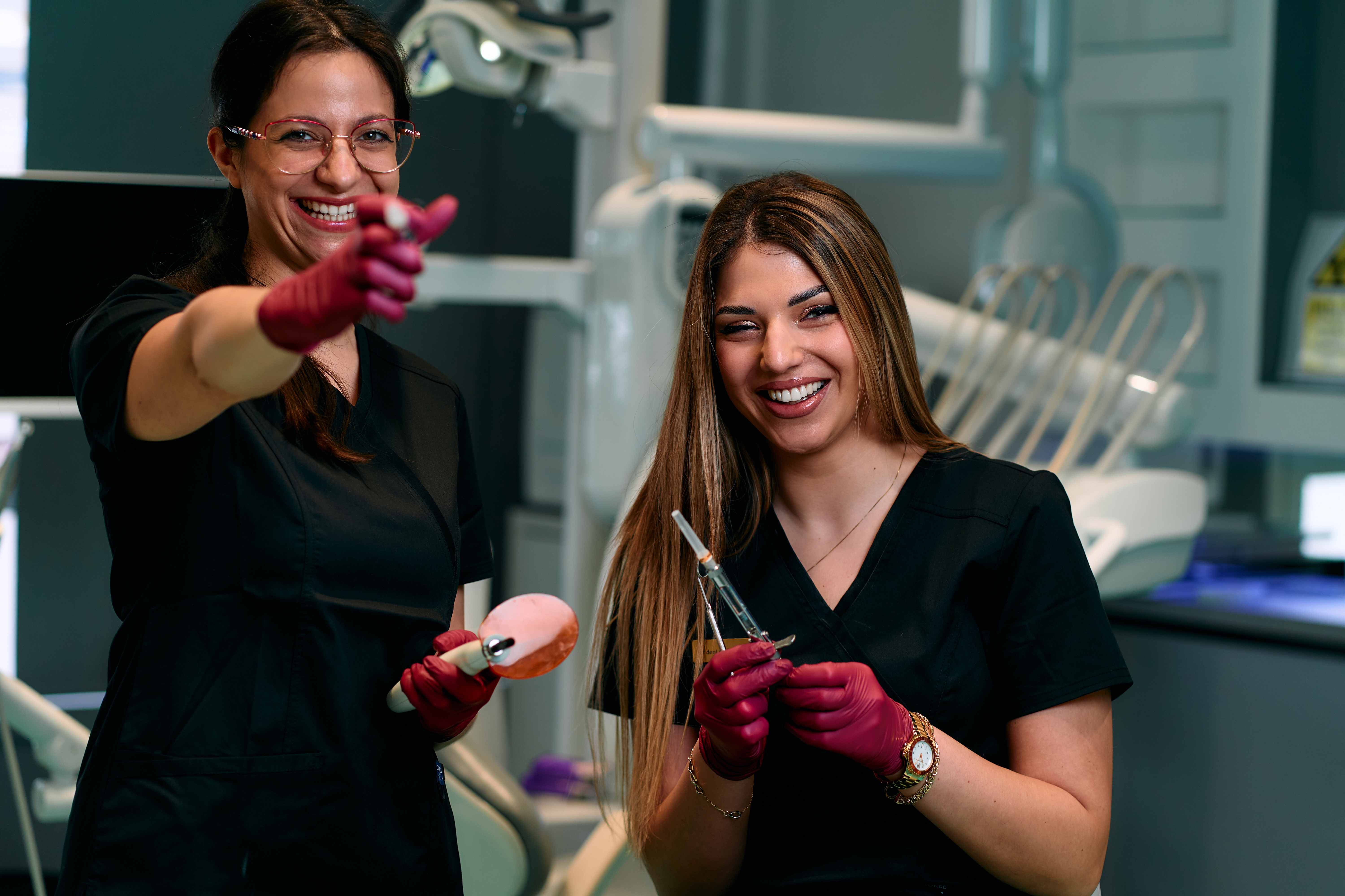 Dental assistant working chairside with a patient in a modern dental office